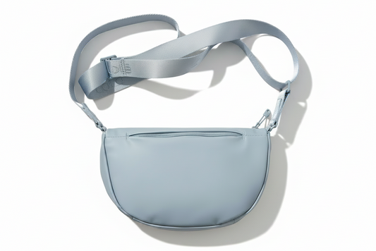 Light blue crossbody bag on a light gray background