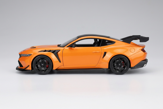 Side profile of the orange Maisto 2025 Ford Mustang GTD 1:18 die-cast model car