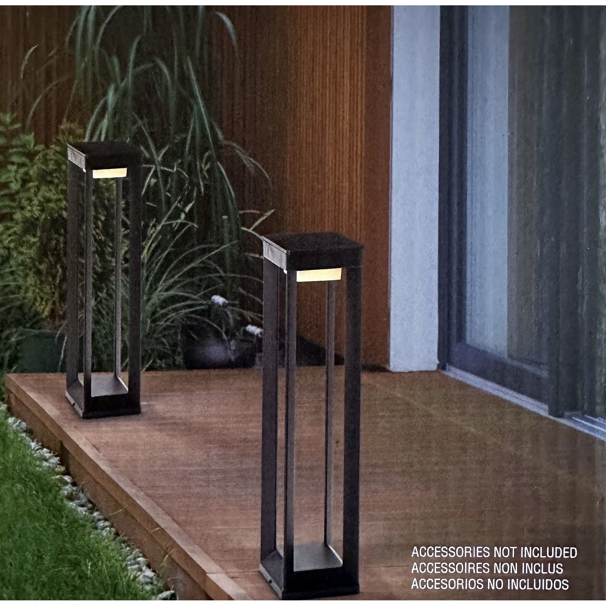 Solar pathway bollard lights shown on an outdoor deck
