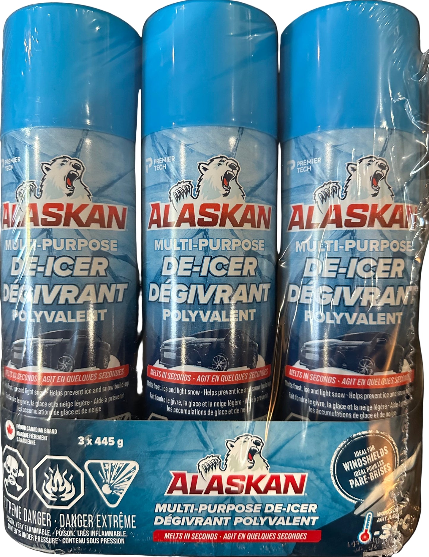 Three cans of Alaskan Multi-Purpose De-Icer on a white background