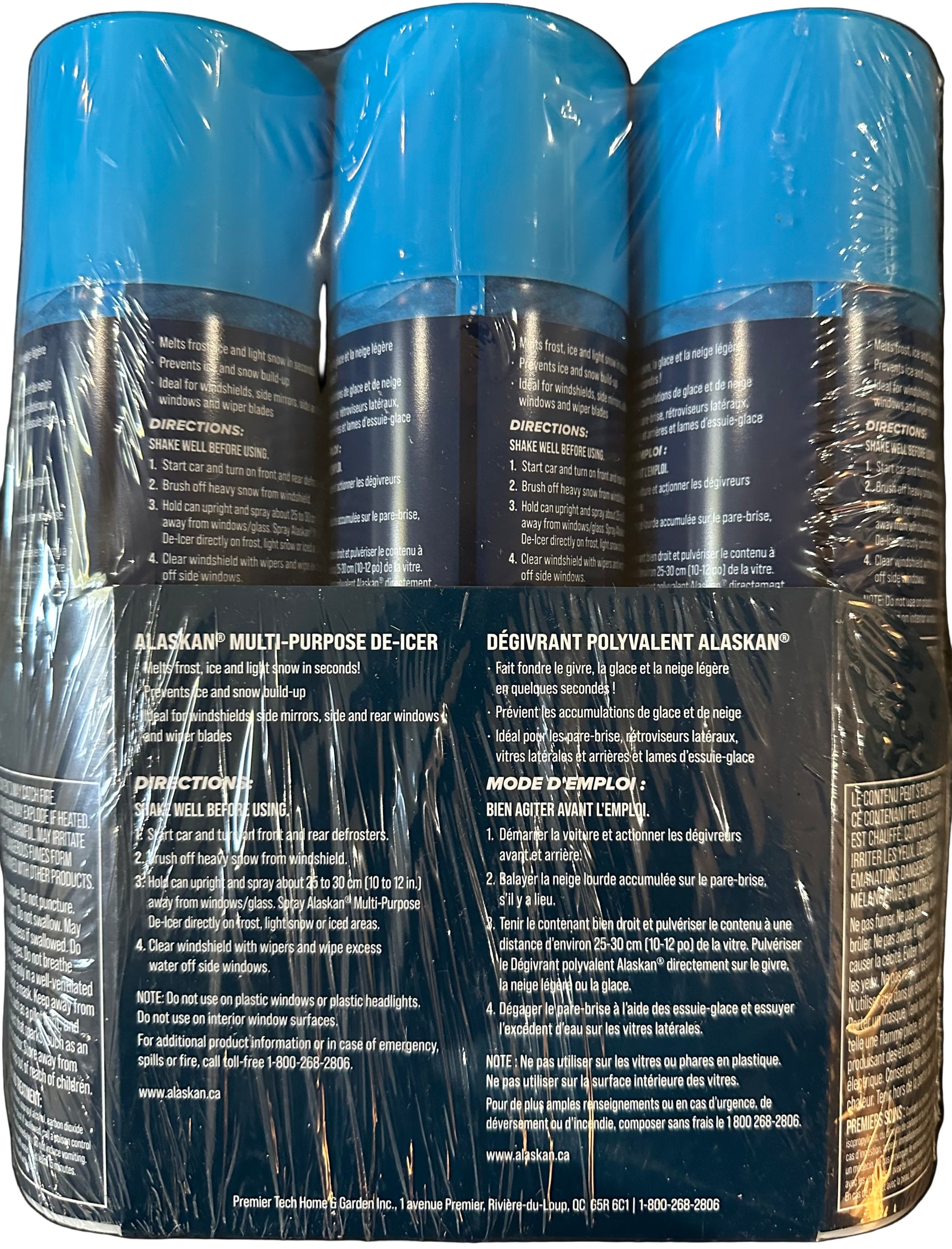 Three Alaskan multi-purpose de-icer cans with blue and black labels.