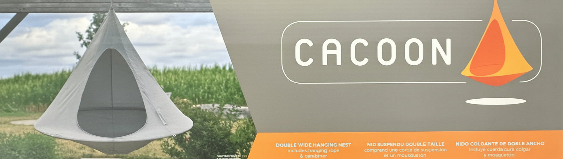 Cacoon tent with a scenic background and brand logo.