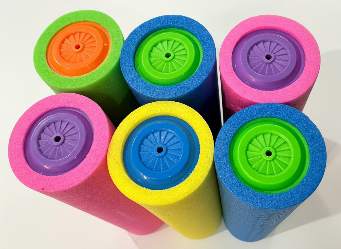 Colorful foam rollers on a black surface