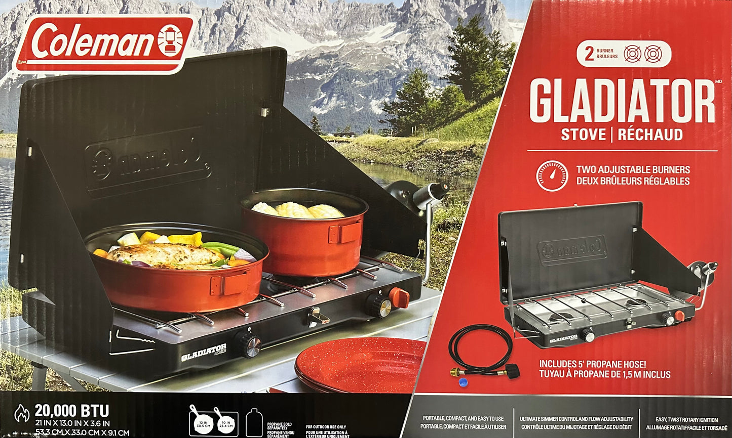 Coleman Gladiator stove with two pots on a camping background