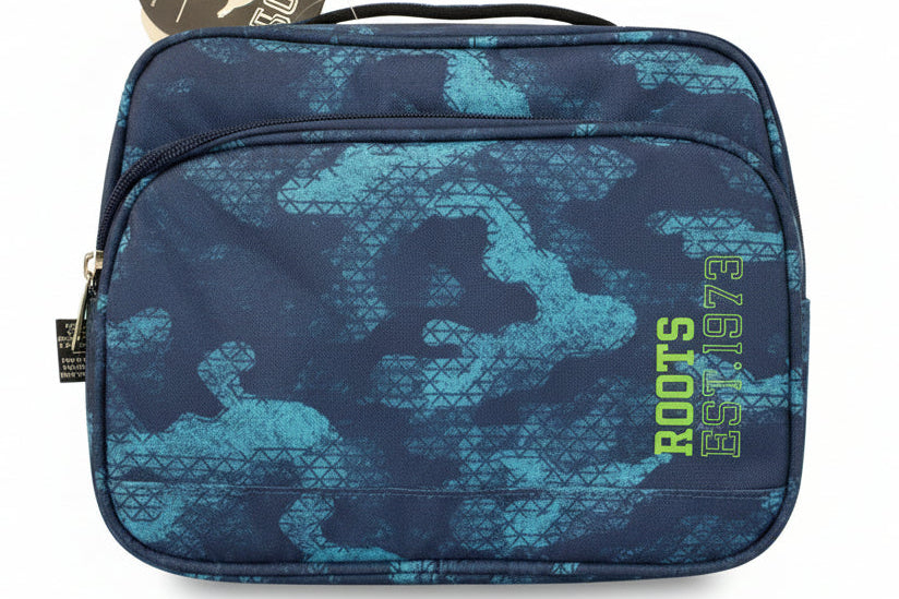 Blue camouflage bag with 'Roots' branding on a dark textured surface