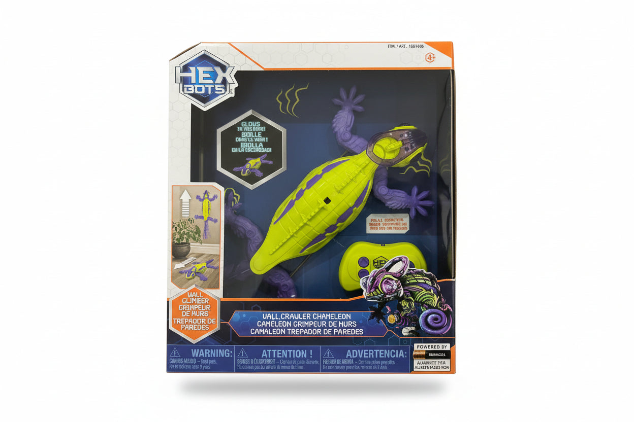 Toy chameleon in packaging with 'Hey! Go!' branding on a dark surface