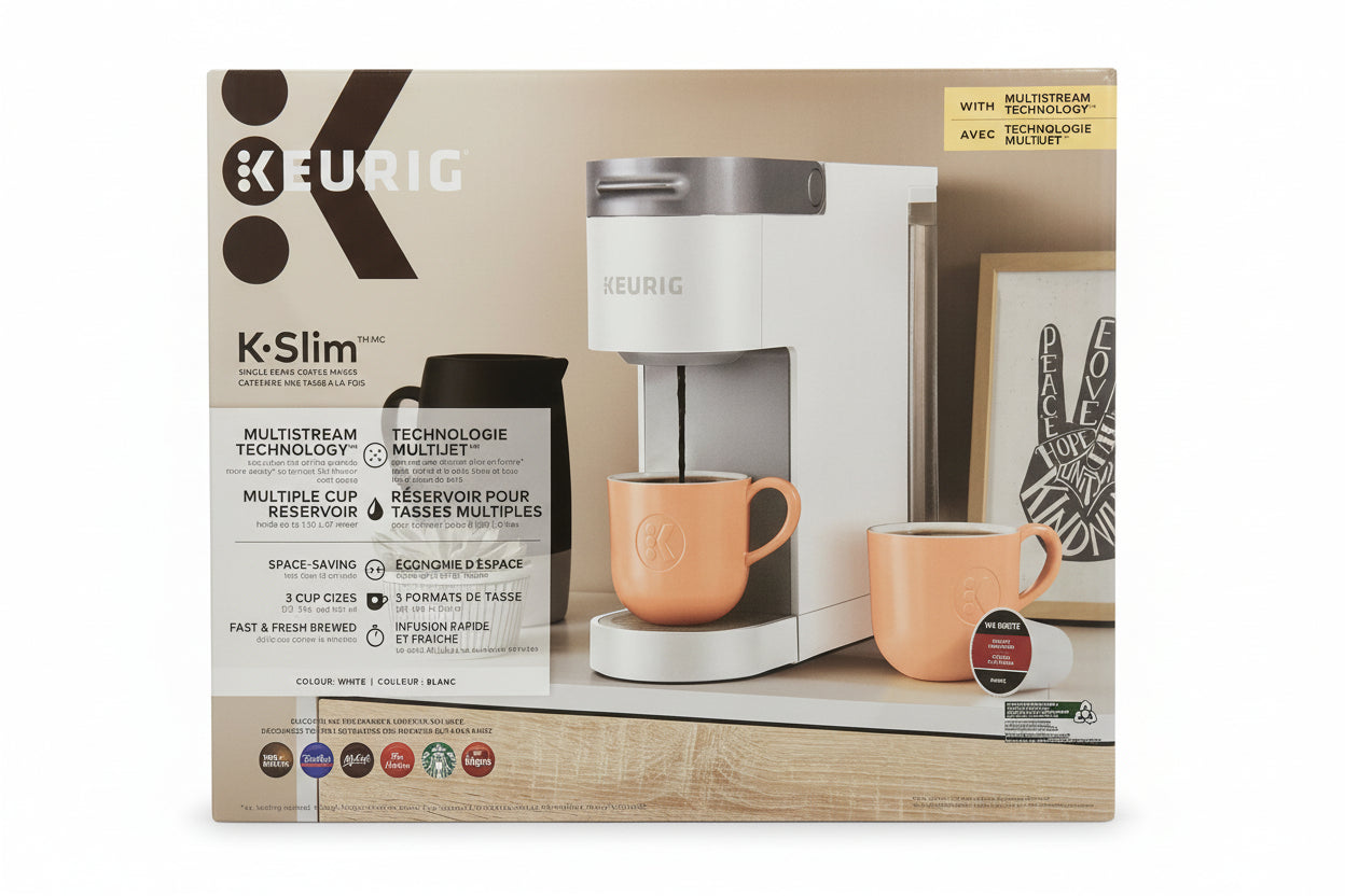 K-Slim Keurig coffee maker packaging with two orange mugs on a wooden surface.