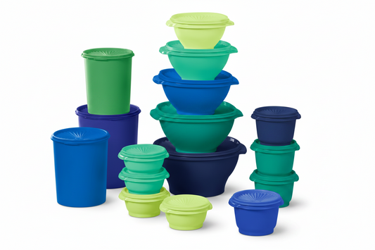 Set of blue and green silicone containers stacked on a white background