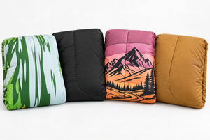 Below Zero 2-in-1 Wearable Outdoor Blanket shown in Green Mountain Landscape, Grey, Mauve Mountain Landscape Print, and Tan colourways
