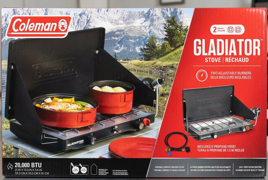 Coleman Gladiator stove with two pots on a camping background