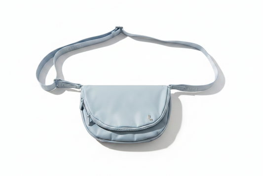 Light blue crossbody bag on a white background