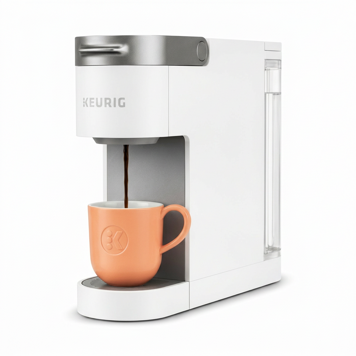 Keurig coffee maker with a peach-colored mug on a white background