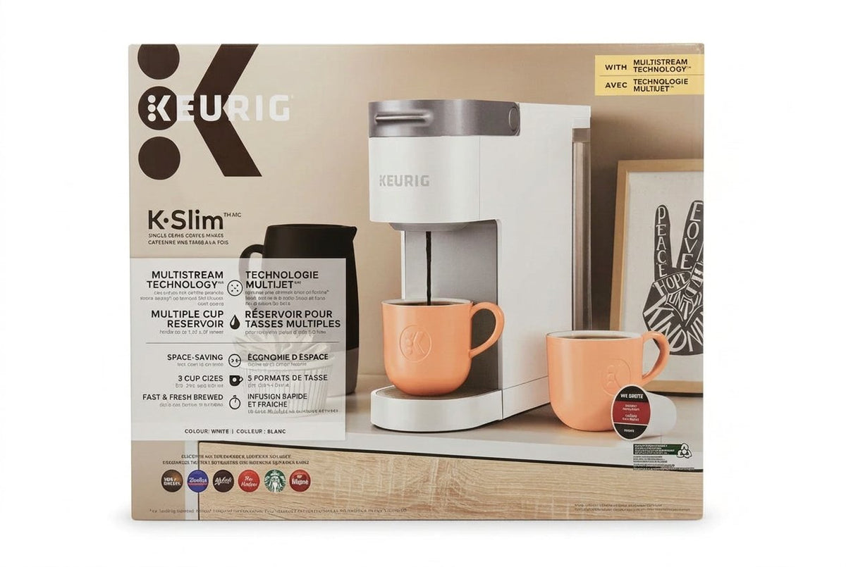 K-Slim Keurig coffee maker packaging with two orange mugs on a wooden surface.
