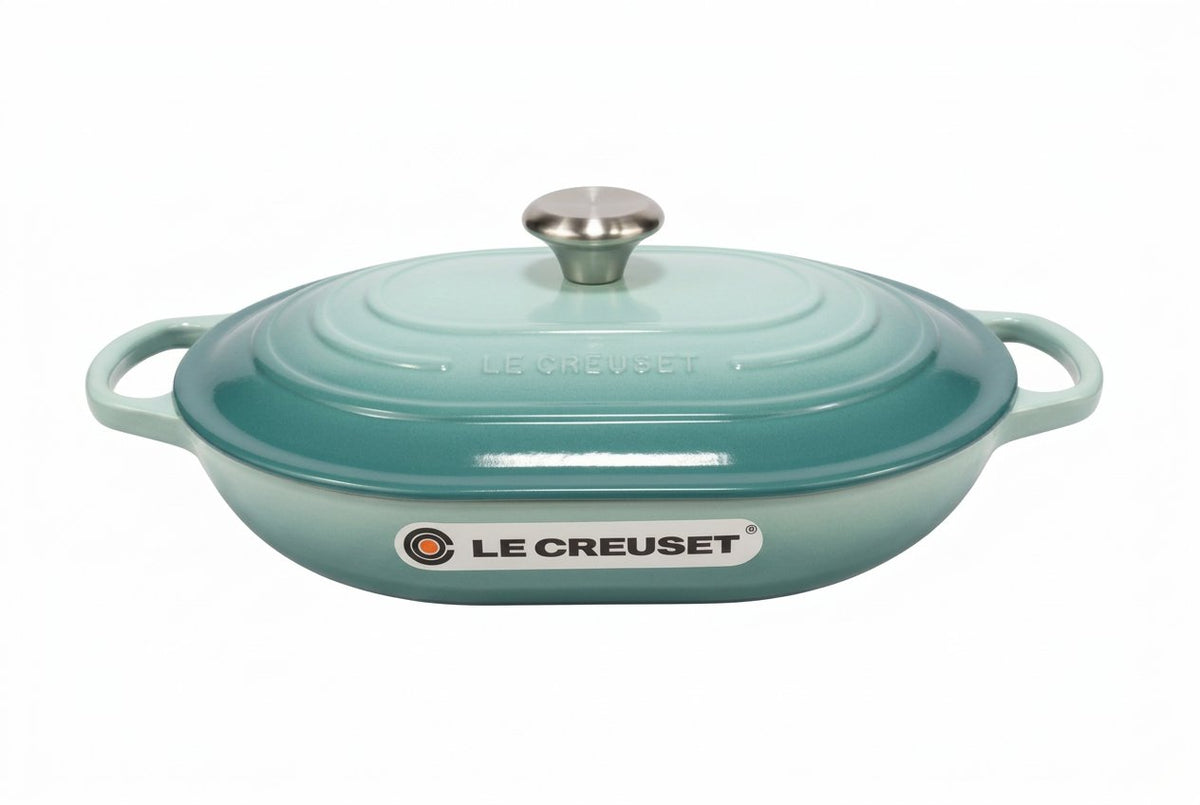 Le Creuset oblong casserole in sage color with lid