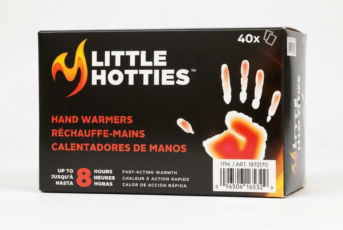 Box of Little Hotties hand warmers with branding and product details on a gray background