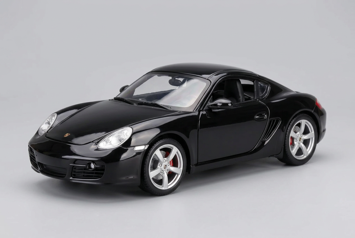Black Maisto Porsche Cayman S 1:18 die-cast model car with silver wheels