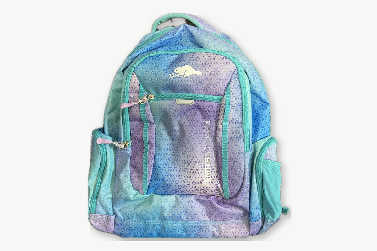 Roots 38L backpack in teal, blue and lavender ombré leaf print, front view with beaver logo
