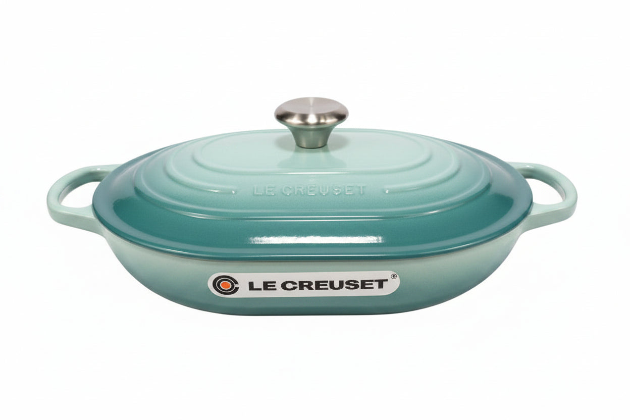 Le Creuset oblong casserole in sage color with lid