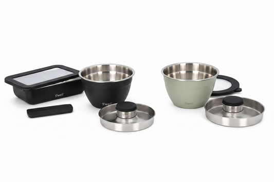 Set of stainless steel kitchen containers on a white background