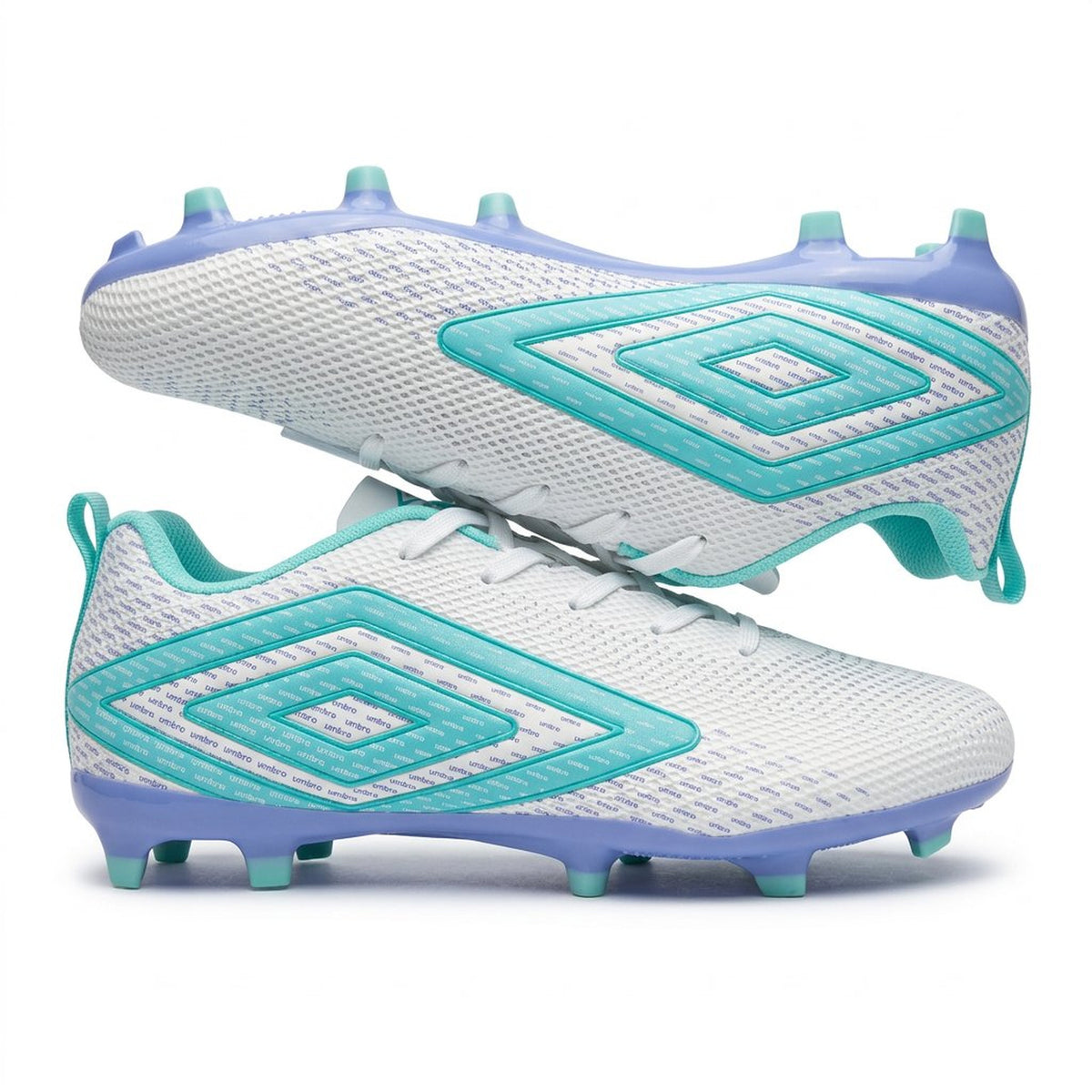 White and blue soccer cleats in a cardboard box on a black speckled surface
