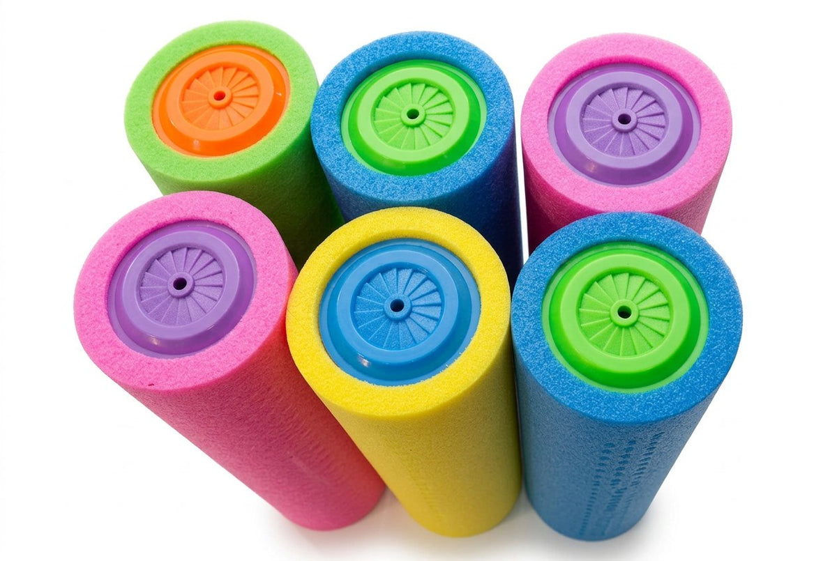 Colorful foam rollers on a black surface